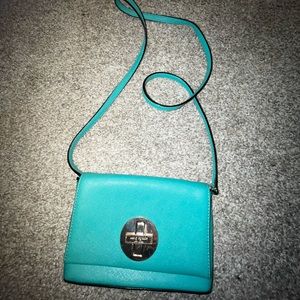 Kate Spade turquoise crossbody purse.